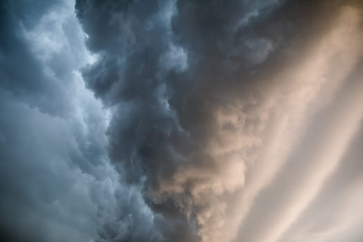 A local hurricane rages over city skyscrapers. The sky is covered with clouds.