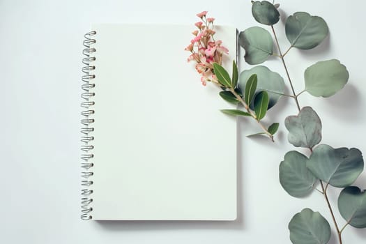 A notebook with a flower resting on top, showcasing a simple yet charming composition. mockup