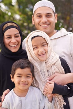 Park, muslim family and portrait of parents with children for bonding, ramadan and outdoors together. Islam, happy people and mother or father with kids for love, childcare and support in nature.