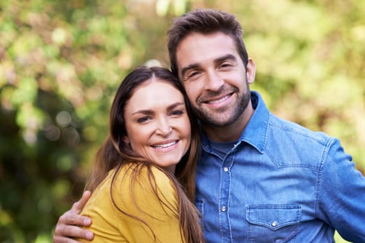 Portrait, couple and outdoor with smile on hug for bonding, love and support to relax together. Relationship, romance and happy or fun at park as family, soulmate and commitment with break.