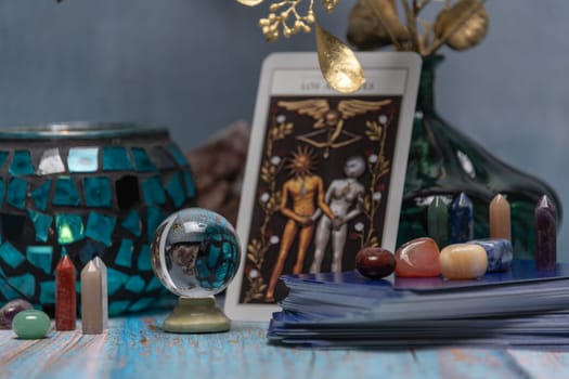 Cartomancy - Pendulum On Blurred Altar With Defocused Tarot Cards