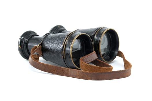 Antique pair of black binoculars with brown leather straps isolated on white background