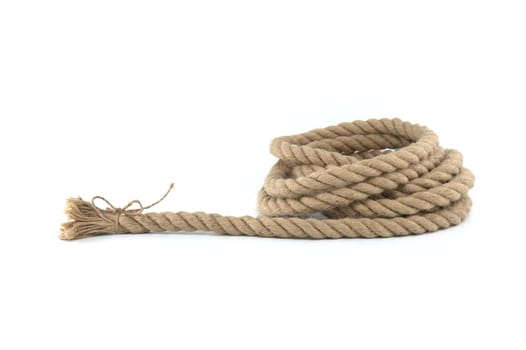 Hemp or jute rope looped and entwined into a circular shape with one end appearing to be tied neatly