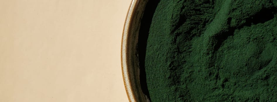 Organic blue-green algae spirulina powder food in plate. Copy space for your text Health benefits of spirulina chlorella. Vitamins and minerals to diet. Detox dietary supplement Seaweed superfood concept