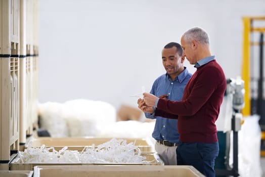 Factory, communication and warehouse inspection of raw materials and quality assurance of stock. Business people, discussion and diversity on site, collaboration and decision on inventory in shelf.