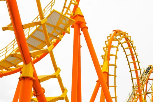 Rollercoaster on white background, closeup of photo.