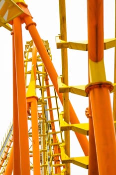 Rollercoaster on white background, closeup of photo.