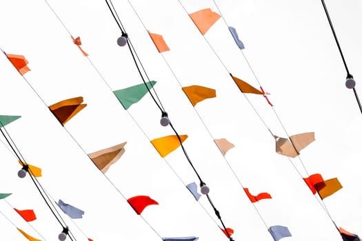 Colorful Hanging Flag on on a string on a white background, close-up