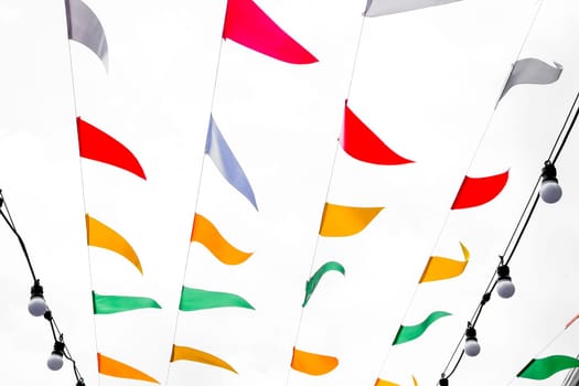 Colorful Hanging Flag on on a string on a white background, close-up