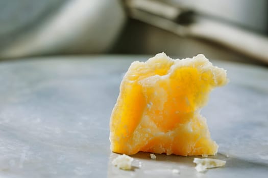 Italian hard cheese Parmesan -Parmigiano Reggiano produced from cow's milk on table 
