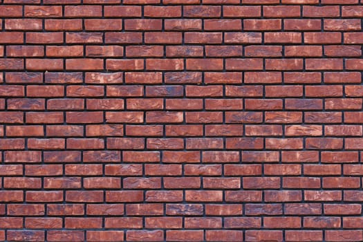 close up of a red brick wall - full-frame background and texture.