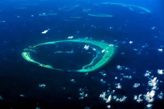 maldives atoll aerial panorama blue water reef