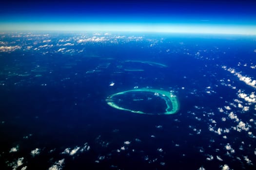 maldives atoll aerial panorama blue water reef