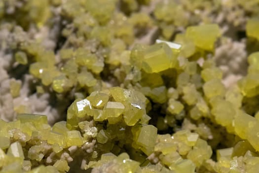 Aragonite rock with yellow sulfur macro