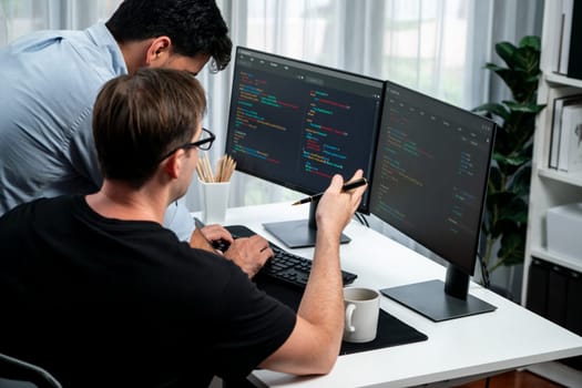 IT developers discussing online software development information on pc screen, creating program coding for latest version application on website. Concept of brainstorming firmware updated. Sellable.