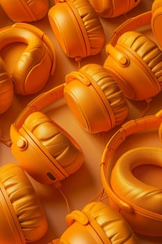 A set of orange headphones highlighted on an orange background.