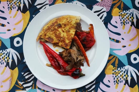 Savor the delightful combination of oven-roasted veggies paired with a fluffy omelette