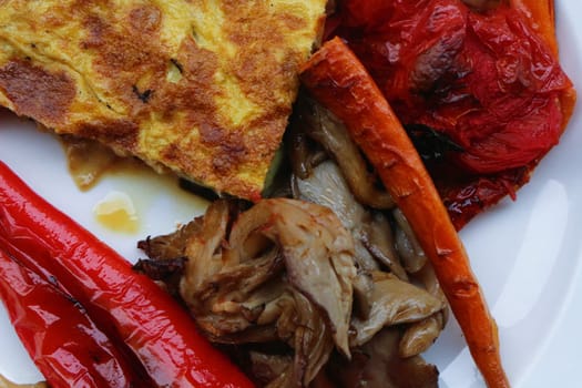 Savor the delightful combination of oven-roasted veggies paired with a fluffy omelette