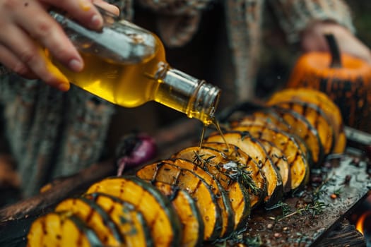 A person cooks food on a grill outdoors. They are using a bottle of oil to season the food as it cooks.