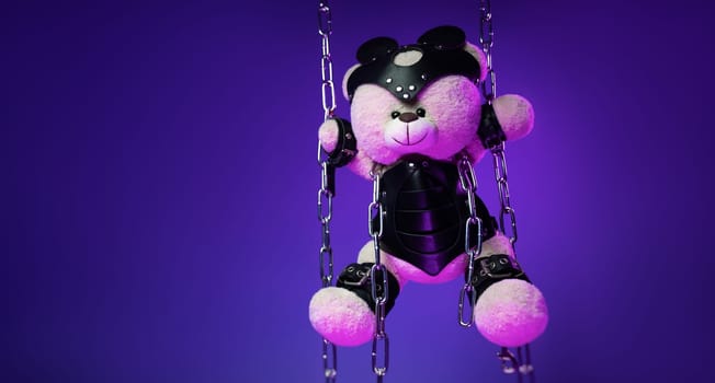 teddy bear in a mask is suspended from chains in leather handcuffs and accessories for bdsm games and sex in neon light against a background of copy paste