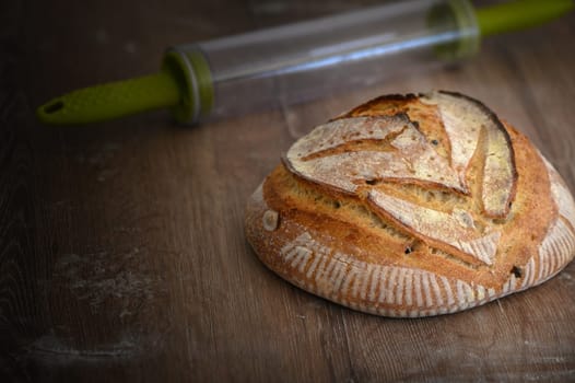 Fresh homemade sourdough bread with whole grain flour on a gray-blue background. Healthy food.2