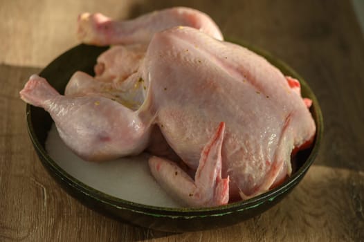 Still life full length raw chicken for roasting preparation 1
