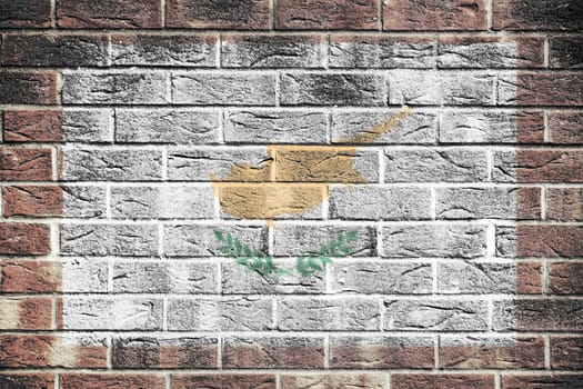 A Cyprus flag painted on brick wall background white gold olive branch