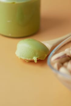 top view a pistachios cream and nuts in a bowl.