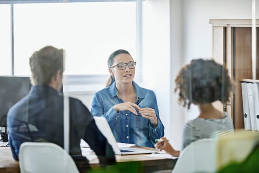 Meeting, communication and team collaboration with business people in public relations discussion. Planning, table and female employee with staff in training with advice and conversation at a company.