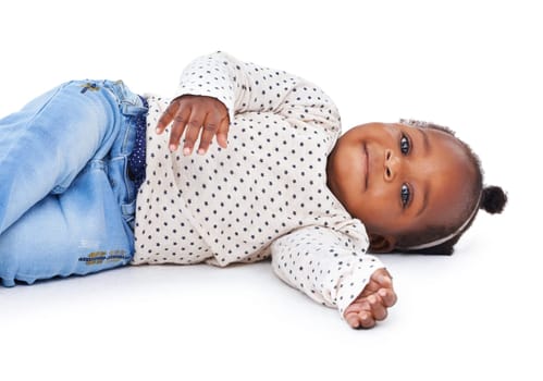 Portrait, baby or girl to relax, lying or happy on floor of mockup studio on white background. Black toddler, ground or smile to rest, calm or healthy as peace, comfort or morning break in childhood.