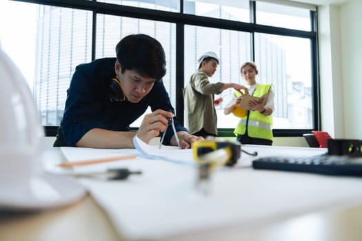 Group of engineer is discussion and brainstorming about condominium model of construction project.