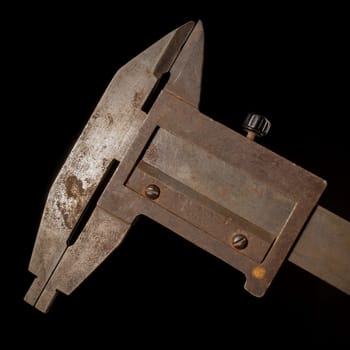 Old tools in front of a black background