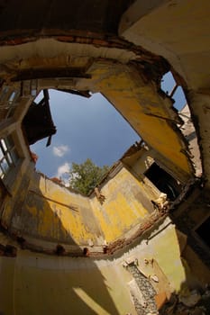 House without a roof after a hurricane, ruins, inside view.