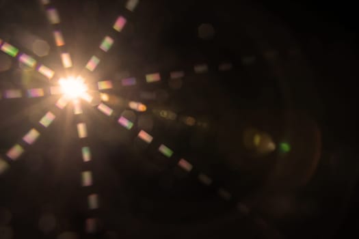 Abstract sun flare. The lens flare is subject to digital correction.