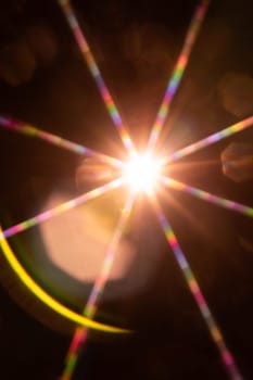 Abstract sun flare. The lens flare is subject to digital correction.