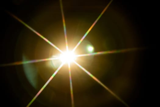 Abstract sun flare. The lens flare is subject to digital correction.