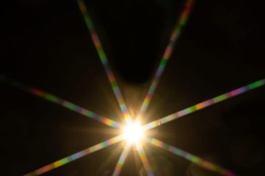 Abstract sun flare. The lens flare is subject to digital correction.