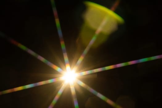 Abstract sun flare. The lens flare is subject to digital correction.