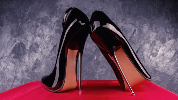 Black fetish shiny patent leather stiletto high heels with ankle strap