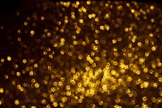 Christmas background. Festive abstract background with bokeh defocused lights and stars.