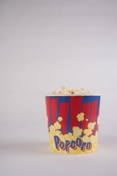 Big bucket of popcorn. Isolated on a white.