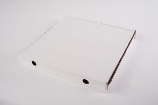 close up of a white pizza box template on white background.