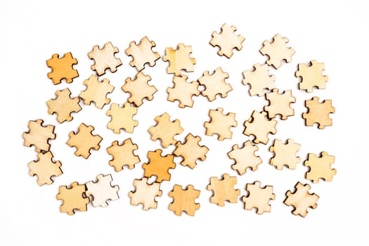 Wooden elements of a puzzle on a white background.