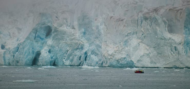 Svalbard Spitzbergen Islands Glacier view with small zodiac 