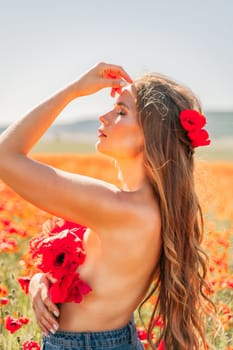 Woman poppies field. portrait of a happy woman with long hair in a poppy field and enjoying the beauty of nature in a warm summer day