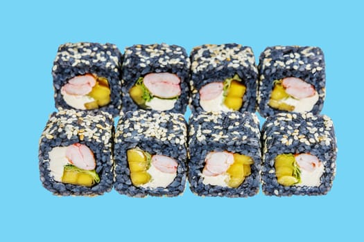 rolls with black rice, shrimp and avocado on a blue background 1