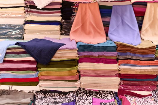 A kaleidoscope of traditional Muslim garments displayed at an Istanbul market reflects the rich cultural heritage of the city.