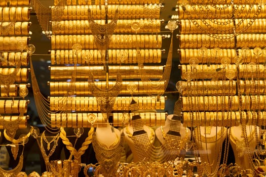 Golden Splendor, Exquisite handcrafted gold jewelry displayed in the bustling streets and traditional workshops of Istanbul.