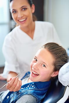 Portrait, girl and dentist with kid, woman and appointment for medical procedure and oral health. Face, professional and child with employee and dental hygiene with care and trust with consultation.