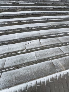 concrete steps covered with snow